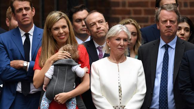 Boris Johnson’s wife, Carrie, second from left, and their daughter, Romy, outside 10 Downing Street in central London on Thursday. Picture: AFP