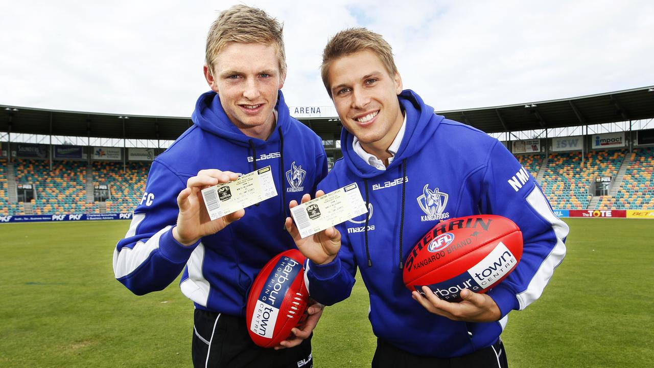 Hobart 2012 – Tickets to the first AFL (Australian Football League) game North Melbourne will play at Blundstone Arena (Bellerive Oval), Hobart, to go on sale, from left, deputy Jack Ziebell and North Melbourne skipper (captain) Andrew Swallow, with the first two tickets for the game against Greater Western Sydney (GWS)