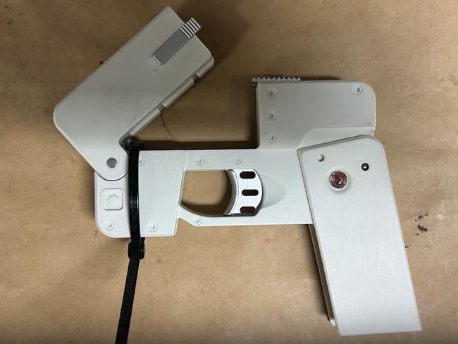 The gun designed to look like an iPhone allegedly found by police in raids on the Gold Coast. Picture: QPS