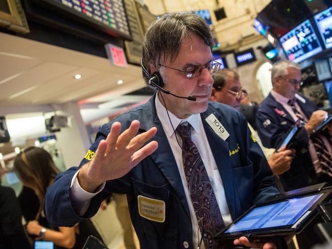 NEW YORK, NY - OCTOBER 21: Traders work on the floor of the New York Stock Exchange after Ferrari Automotive Company's IPO on October 21, 2015 in New York City. Ferrari will trade under the symbol RACE. Andrew Burton/Getty Images/AFP == FOR NEWSPAPERS, INTERNET, TELCOS & TELEVISION USE ONLY ==
