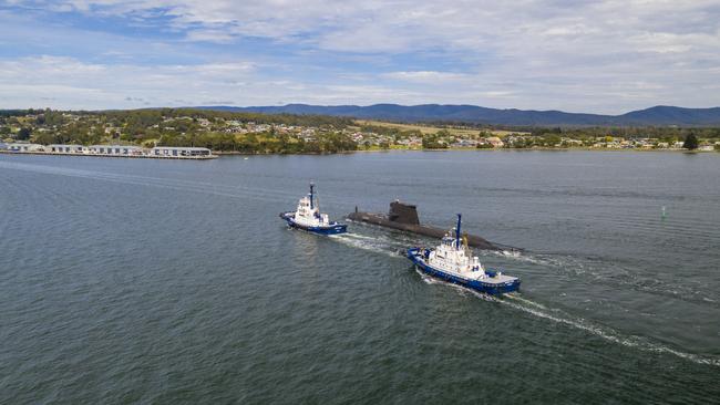 HMAS Sheean sails down the Tamar River