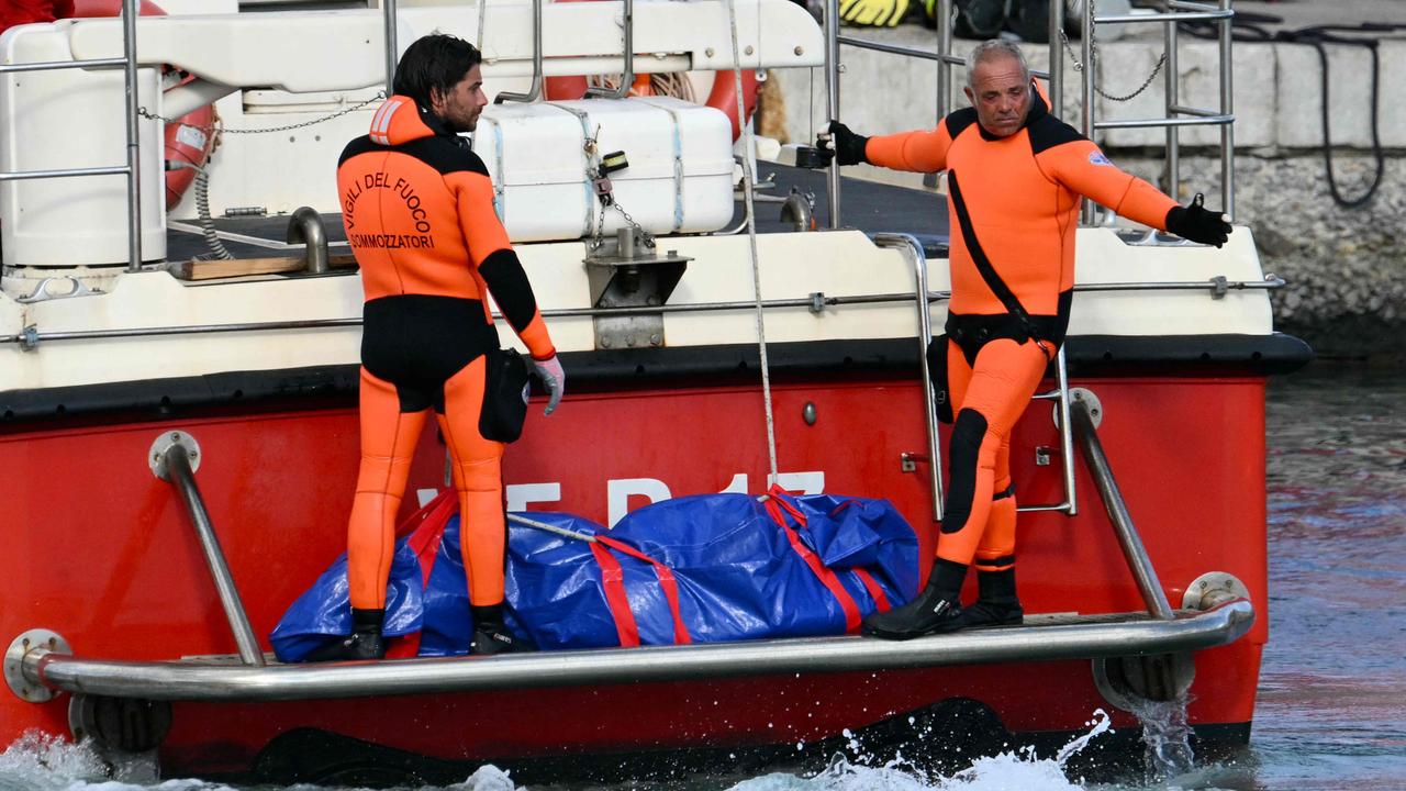 Divers helping in the search of the vessel. Photo: AFP