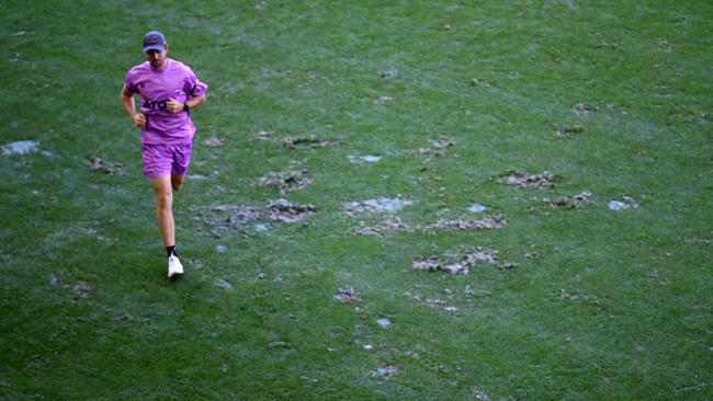 The divots in front of the players’ interchange benches at Marvel Stadium. Pic: Michael Klein.