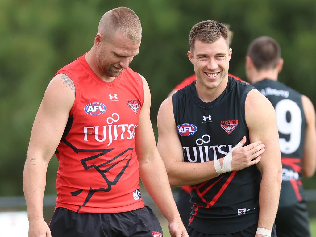 MELBOURNE, AUSTRALIA – JANUARY 30 2024 Jake Stringer and Zach Merrett at Essendon pre-season training at the Hanger. Picture: Brendan Beckett