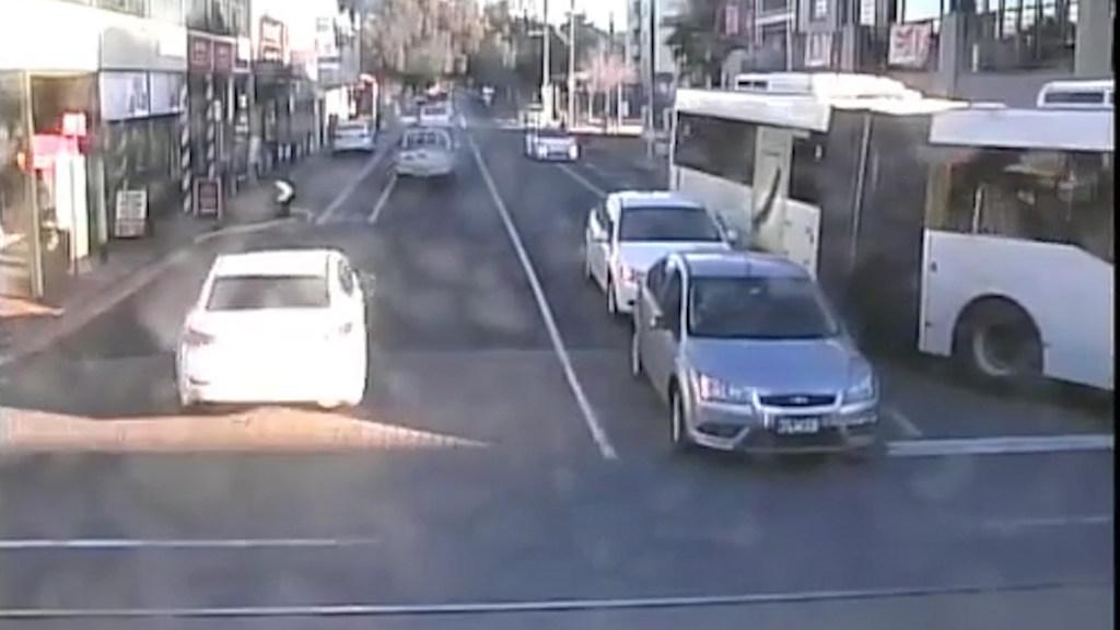 Bus scrapes car - caught on CCTV