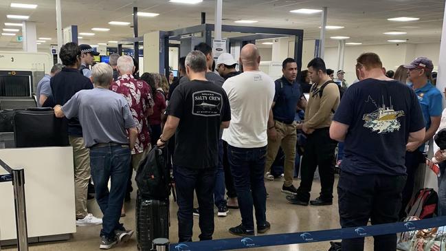 Lines of waiting passengers at Darwin Airport terminal on Friday. Picture: Supplied.