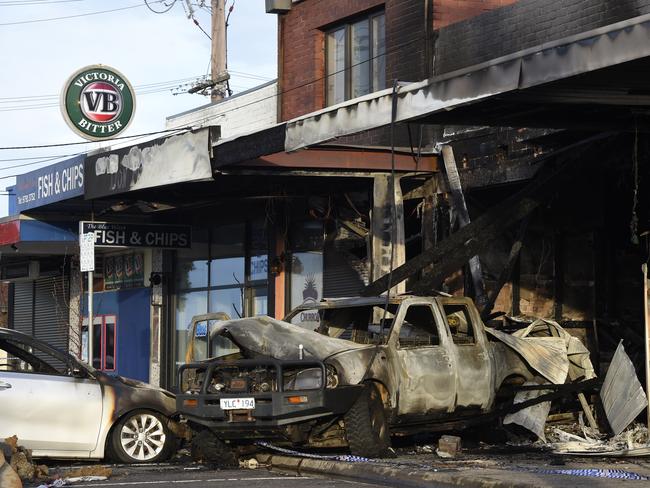 Two stolen cars and several businesses on Heyington Cres in Noble Park were destroyed by fire in an overnight arson spree. Picture: Andrew Henshaw