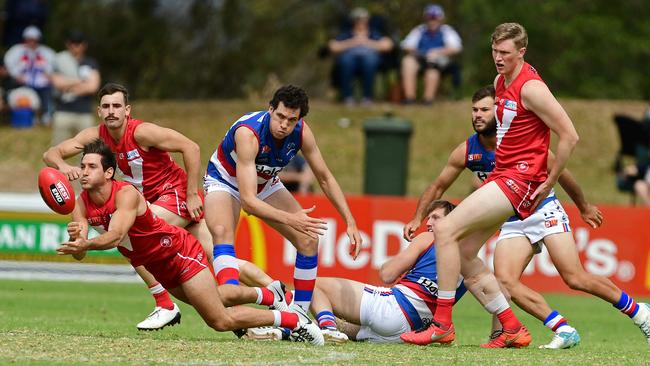 North Adelaide recruit Aidan Tropiano fires out a handpass. Picture: Tom Huntley