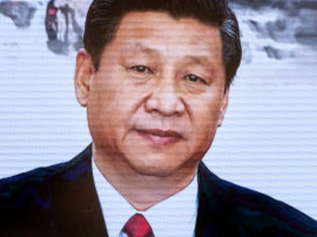 BEIJING, CHINA - DECEMBER 16: Chinese president Xi Jinping is seen in a video as people visit the Museum of the Communist Party of China on December 16, 2021 in Beijing, China. The museum was officially opened in June 2021, the year the party celebrated the 100th anniversary of its funding. (Photo by Andrea Verdelli/Getty Images)
