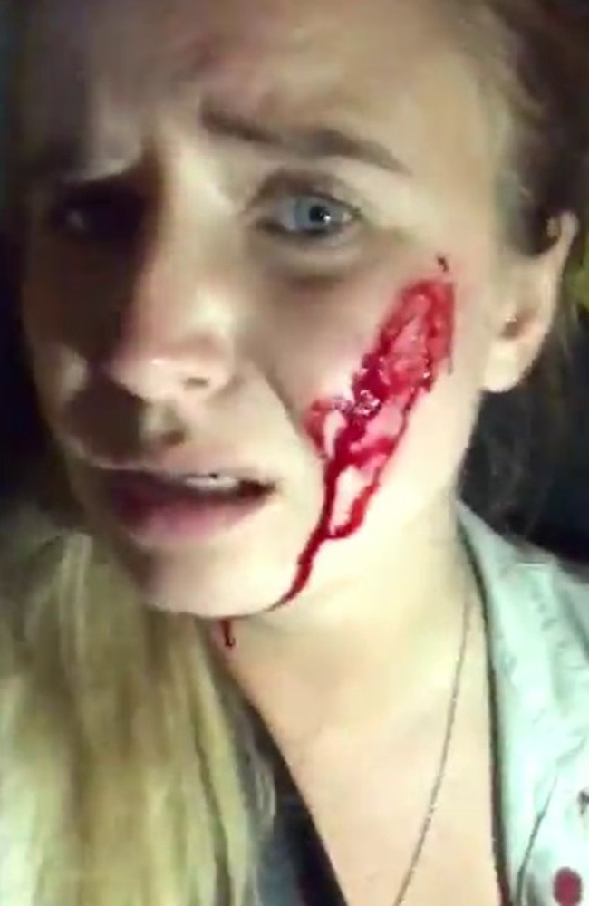 Blood drips down the woman’s face in the video.