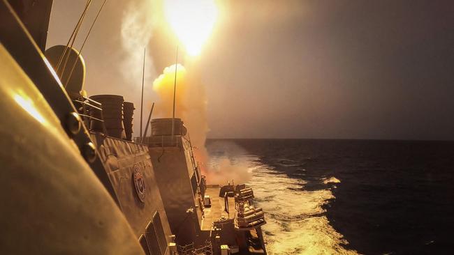 The guided-missile destroyer USS Carney defeats a combination of Houthi missiles and unmanned aerial vehicles in the Red Sea. Picture: Aaron Lau / US NAVY / AFP