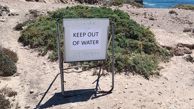 Mr Outtram said locals placed a sign near the beach after the attack. Picture: Swellnet