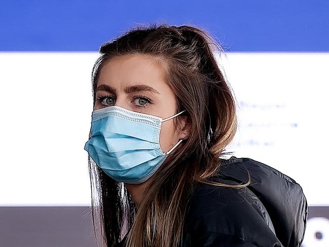 MELBOURNE, AUSTRALIA - NewsWire Photos 24 AUGUST 2021 : A young woman lines up at the Melbourne Convention Exhibition Centre to get a Covid-19 vaccination. Picture : NCA NewsWire / Ian Currie