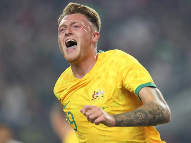 ARLINGTON, TEXAS - SEPTEMBER 9: Harry Souttar #19 of Australia celebrates after scoring the opening goal during the friendly match between Mexico and Australia at AT&T Stadium on September 9, 2023 in Arlington, Texas. (Photo by Omar Vega/Getty Images)