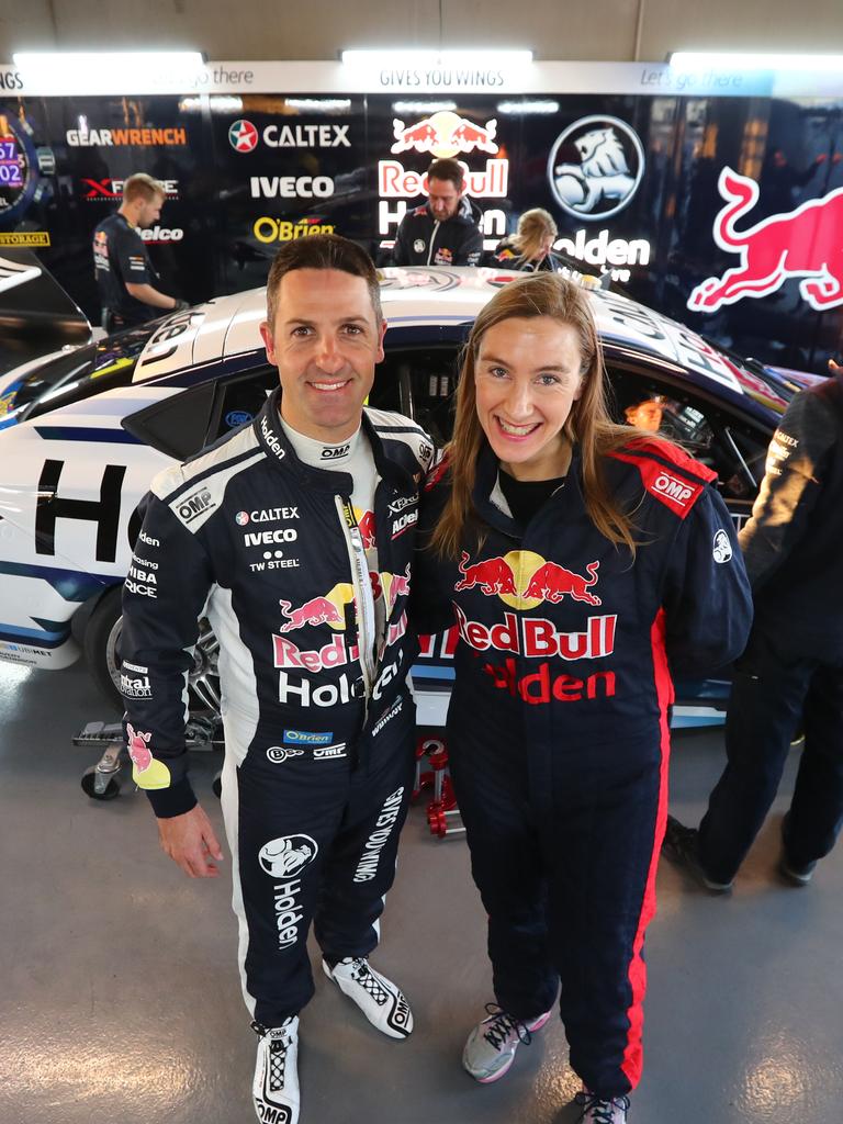 Red Bull Holden racing team driver Jamie Whincup with journalist Cara Jenkin, who joined him on a hot lap. Picture: TAIT SCHMAAL.