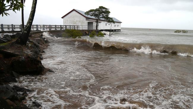 Swell and wind hit the beach outside the old Port Douglas sugar terminal wharf. Picture: Peter Carruthers