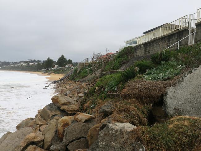 Huge swells have cause massive erosion problems at Wamberal where houses are teetering on the edge. Picture: Richard Noone