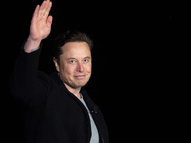 (FILES) In this file photo taken on February 10, 2022 Elon Musk gestures as he speaks during a press conference at SpaceX's Starbase facility near Boca Chica Village in South Texas. - Twitter suspended December 15, 2022, the accounts of more than a half-dozen journalists who had been writing about the company and its new owner Elon Musk. Some of the journalists had been tweeting about Twitter shutting down an @ElonJet account that tracked flights of the billionaire's private jet and about versions of that account hosted at other social networks. (Photo by JIM WATSON / AFP)