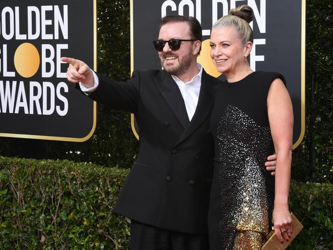 A candid moment from the Golden Globes host, left, at The Beverly Hilton Hotel. Picture: Getty Images