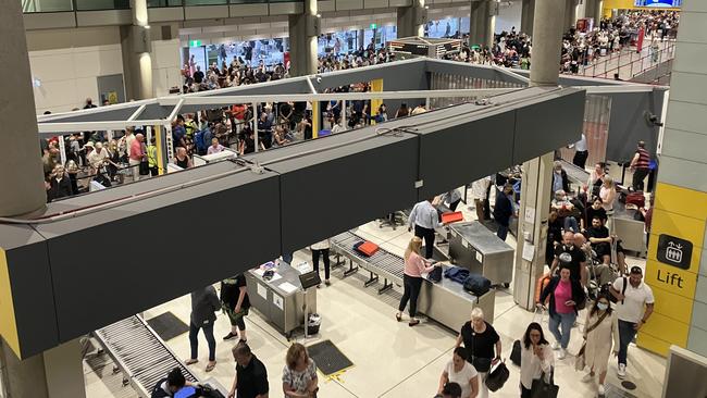 Line for passengers to go through security at the Brisbane Domestic Airport. Picture: Kieran Pelly