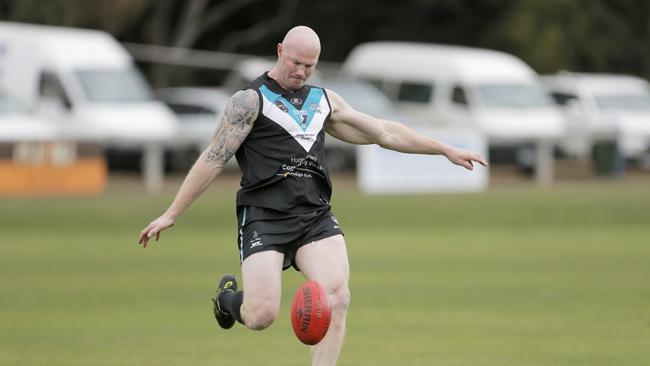 Former AFL star Barry Hall kicks a goal for Cygnet against Lindisfarne in Tasmania's Southern Football League. Picture: PATRICK GEE