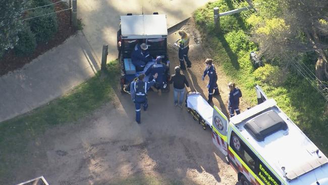 Paramedics treat the man. Picture: Channel 9