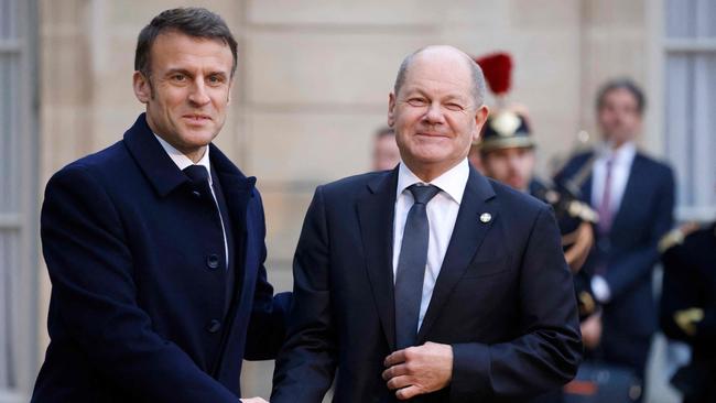 France's President Emmanuel Macron greets Germany's Chancellor Olaf Scholz. Picture: AFP.