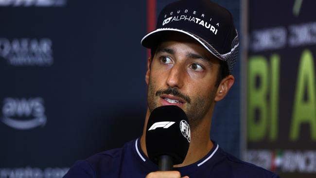 Daniel Ricciardo speaks to reporters. (Photo by Clive Rose/Getty Images)