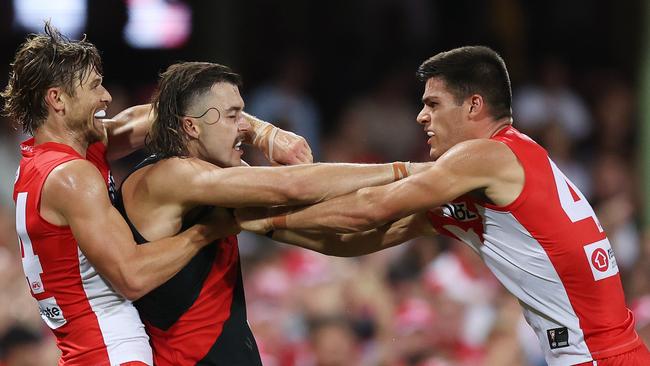 SYDNEY, AUSTRALIA - MARCH 23: Lewis Melican of the Swans and Sam Draper of the Bombers tussle during the round two AFL match between Sydney Swans and Essendon Bombers at SCG, on March 23, 2024, in Sydney, Australia. (Photo by Mark Metcalfe/AFL Photos/via Getty Images )