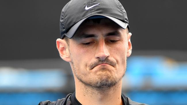 Bernard Tomic of Australia reacts against Lorenzo Sonego of Italy during qualifying round 3 for the Australian Open tennis tournament, Sunday, January 14, 2018. (AAP Image/Julian Smith) NO ARCHIVING, EDITORIAL USE ONLY