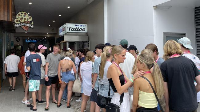 The queue at an airbrush tattoo booth in Caville Ave. Picture: Georgina Noack