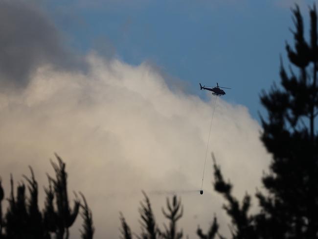 A Tasmanian firefighter is in a workers’ compensation battle with the government after sustaining an injury in January’s bushfires. Picture: LUKE BOWDEN