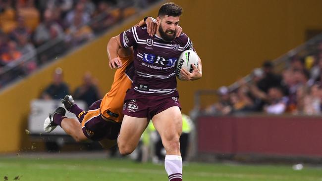 Abbas Miski tries to escape the Tom Dearden tackle. Picture: AAP Image/Dave Hunt