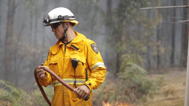 TFS crews conduct a controlled burn in Donnellys Road, Geeveston to protect a house. Picture: RICHARD JUPE