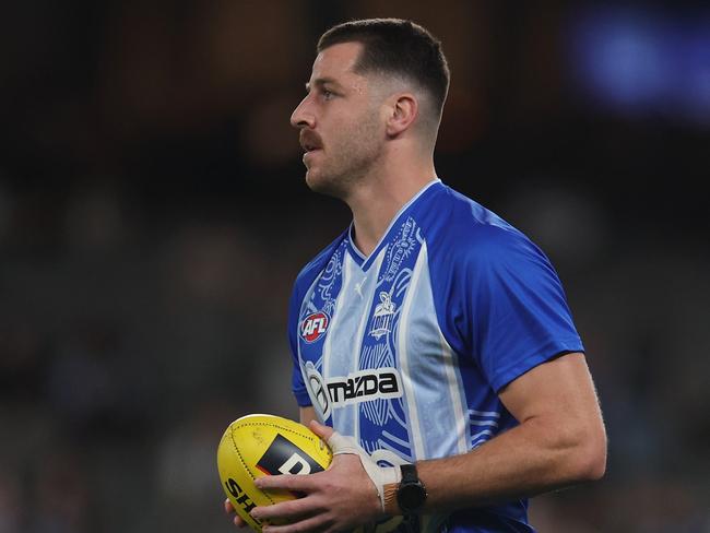 MELBOURNE, AUSTRALIA - APRIL 18: Tristan Xerri of the Kangaroos warms up ahead of the round six AFL match between North Melbourne Kangaroos and Carlton Blues at Marvel Stadium, on April 18, 2025, in Melbourne, Australia. (Photo by Daniel Pockett/Getty Images)