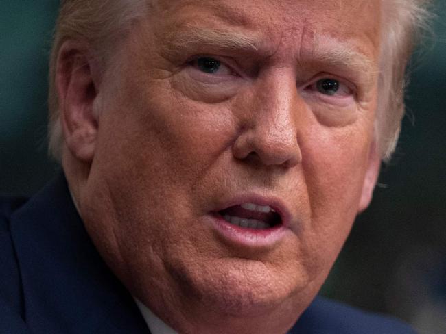 US President Donald Trump speaks to reporters after participating in a Thanksgiving teleconference with members of the United States Military, at the White House in Washington, DC, on November 26, 2020. (Photo by ANDREW CABALLERO-REYNOLDS / AFP)