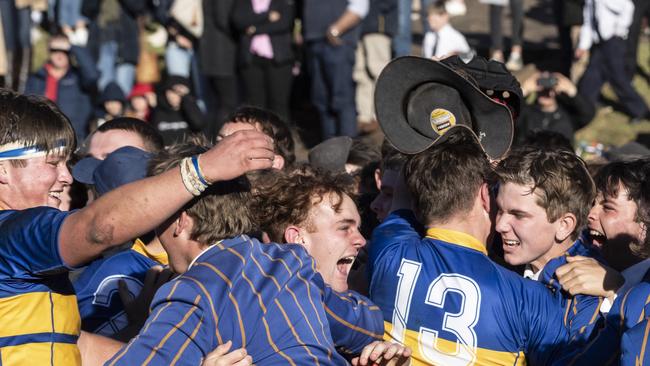 Charlie Wigan (left) and Will Johnston celebrate their win with school mates. O'Callaghan Cup at Toowoomba Grammar School, Grammar vs Downlands. Saturday, July 24, 2021. Picture: Nev Madsen.