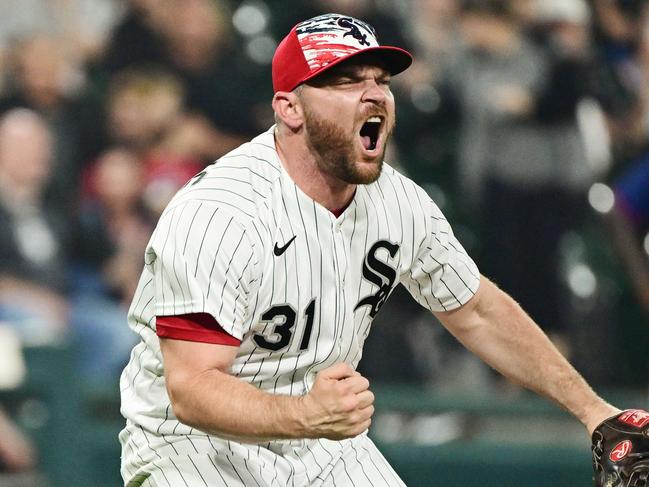 CHICAGO, ILLINOIS - JULY 04: Liam Hendriks #31 of the Chicago White Sox reacts after striking out a batter in the eighth inning against the Minnesota Twins at Guaranteed Rate Field on July 04, 2022 in Chicago, Illinois.   Quinn Harris/Getty Images/AFP == FOR NEWSPAPERS, INTERNET, TELCOS & TELEVISION USE ONLY ==
