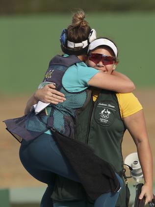 Catherine Skinner gets a hug from Laetisha Scanlan. Picture: AP Photo