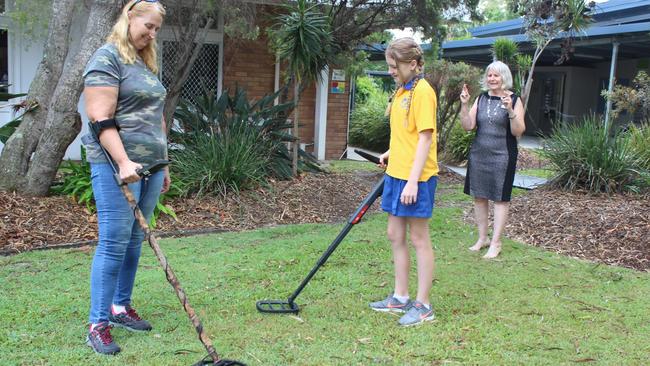 \Coolangatta resident Karen Preston, her daughter and school student Sienna and school principal Sharyn Mahony have all been working hard to track down the time capsule. Photo: Supplied