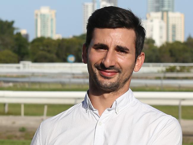 Trainer Michael Costa of New Breed Racing, who relocated to the Gold Coast poses with his 3-year-old gelding Stanley at the Gold Coast Turf Club, Gold Coast. Photo: Regi Varghese