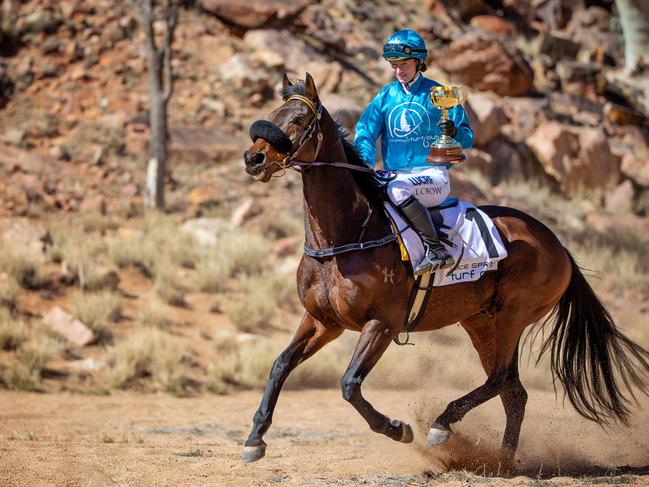 Jockey Lorelle Crow rides Russell Bell-trained Dune Buggy on the dry bed of the Todd River in Alice Springs. Picture: Mark Stewart