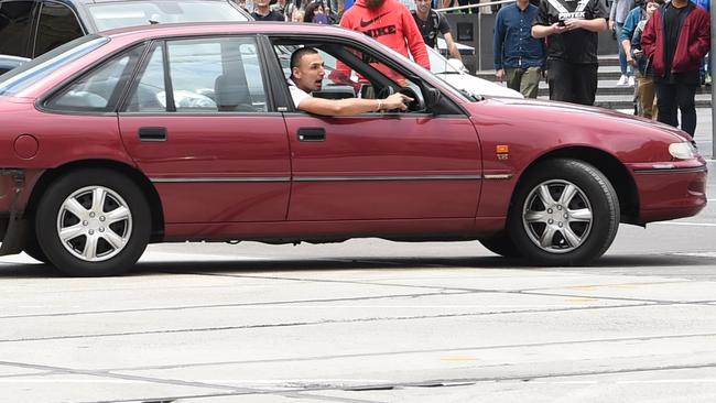 The car pictured outside Flinders St railway station before the deaths. Picture: Tony Gough