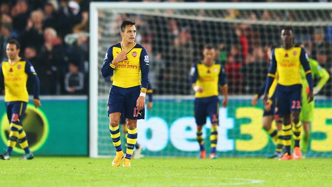 SWANSEA, WALES - NOVEMBER 09: Alexis Sanchez of Arsenal (17) and team mates look dejected as they concede a goal during the Barclays Premier League match between Swansea City and Arsenal at Liberty Stadium on November 9, 2014 in Swansea, Wales. (Photo by Michael Steele/Getty Images)