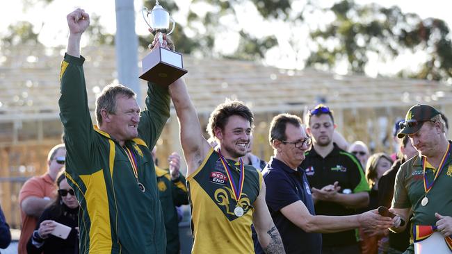 Marion coach Ben Porter and captain Stephen Saunders lift the division seven trophy. Picture: AAP/Bianca De Marchi