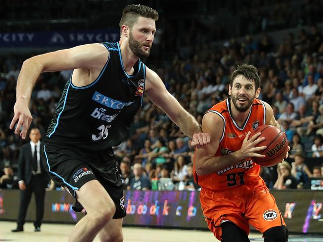 Alex Pledger (left) guards the basket for the Breakers. Picture: AAP