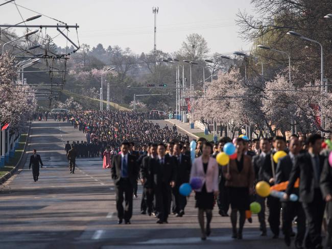 Attendees make their way to the opening ceremony for the Ryomyong Street housing development in Pyongyang on 13 April 2017. Picture: Ed Jones/AFP