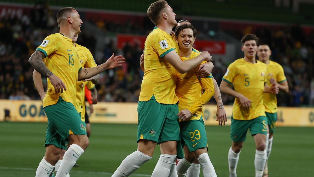 Harry Souttar and Craig Goodwin celebrate a Socceroos goal against Bangladesh. Picture: Michael Klein