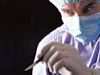 Surgeon with scalpel/file