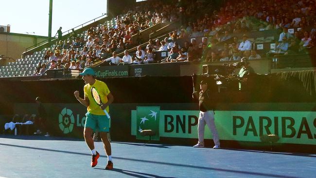 Alex de Minaur celebrates his debut Davis Cup win against Bosnia and Herzegovina at Memorial Drive in February. He will return for the Adelaide International in January. Picture: Scott Barbour/Getty Images